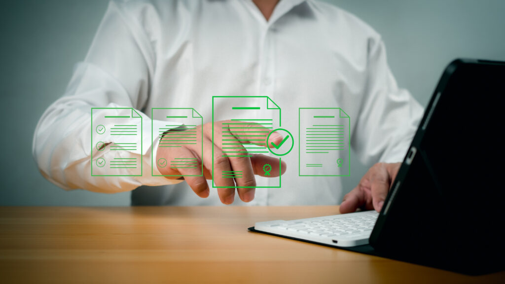 document management man signs an electronic document on digital